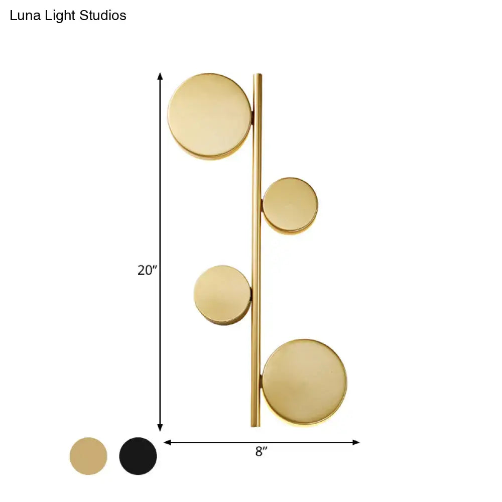 Modern gold vertical linear sconce light with black gold finish and four circular discs for living room lighting