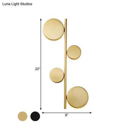 Modern gold vertical linear sconce light with black gold finish and four circular discs for living room lighting
