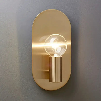 Modern gold wall lamp sconce with brass oval design and clear filament bulb for stylish bedroom decorbites gold wall lamp