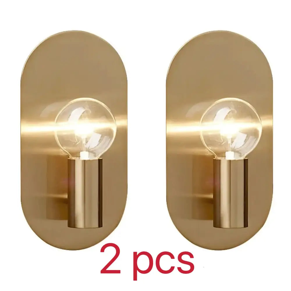 Pair of modern gold wall lamps with brass finish and exposed filament bulbs ideal for bedroom decorbites gold wall lamp