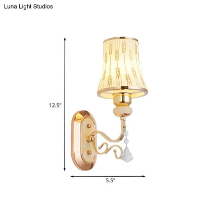 Modern gold wall lamp with arc wheat patterned glass beige lampshade and dangling crystal beads for bedroom sconce