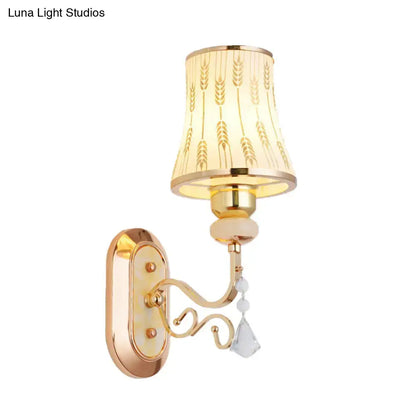 Modern gold wall lamp with arc wheat patterned glass and cream lampshade featuring gold wheat and crystal beads
