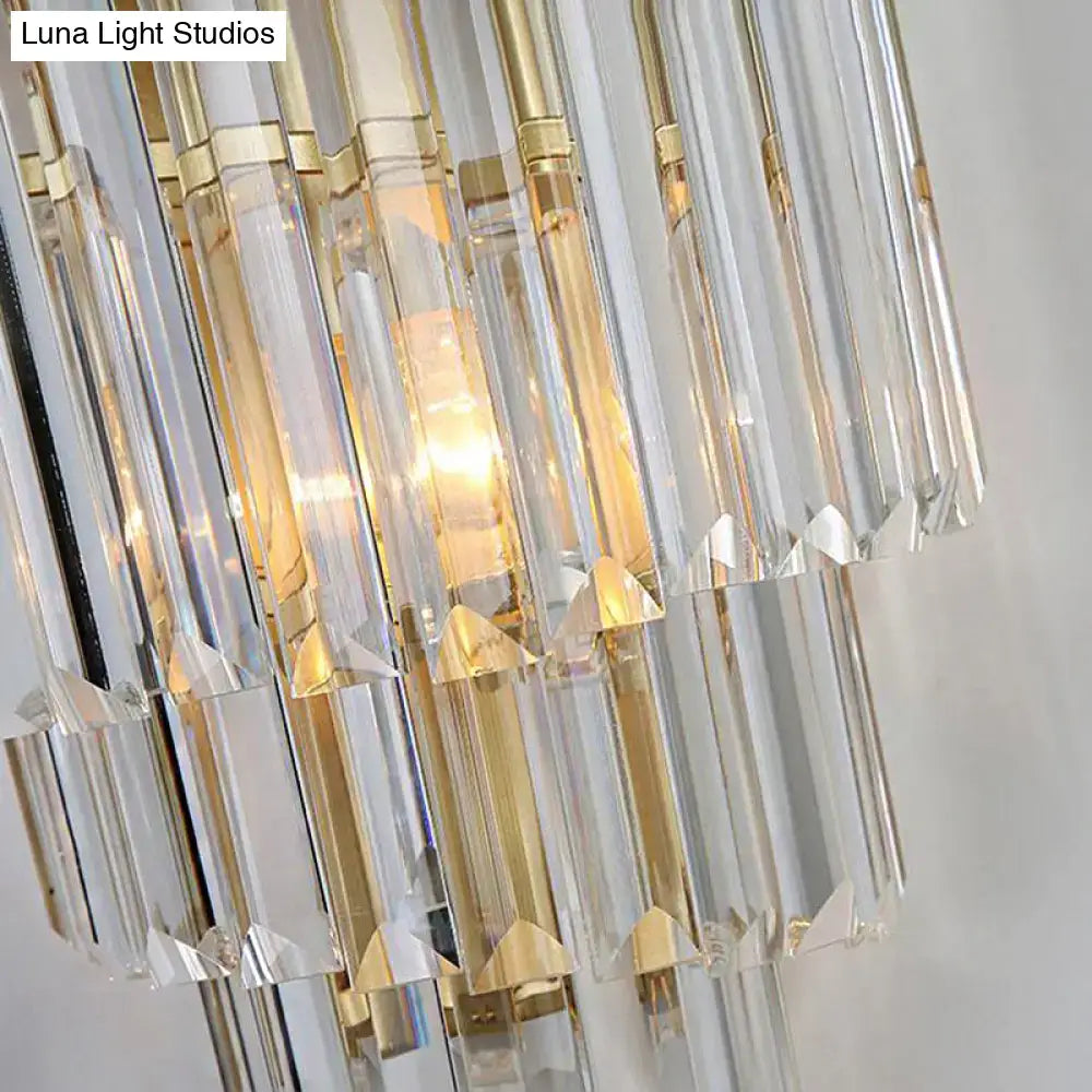 Modern gold wall lamp with cascading clear crystal block prisms and warm light for bedroom lighting