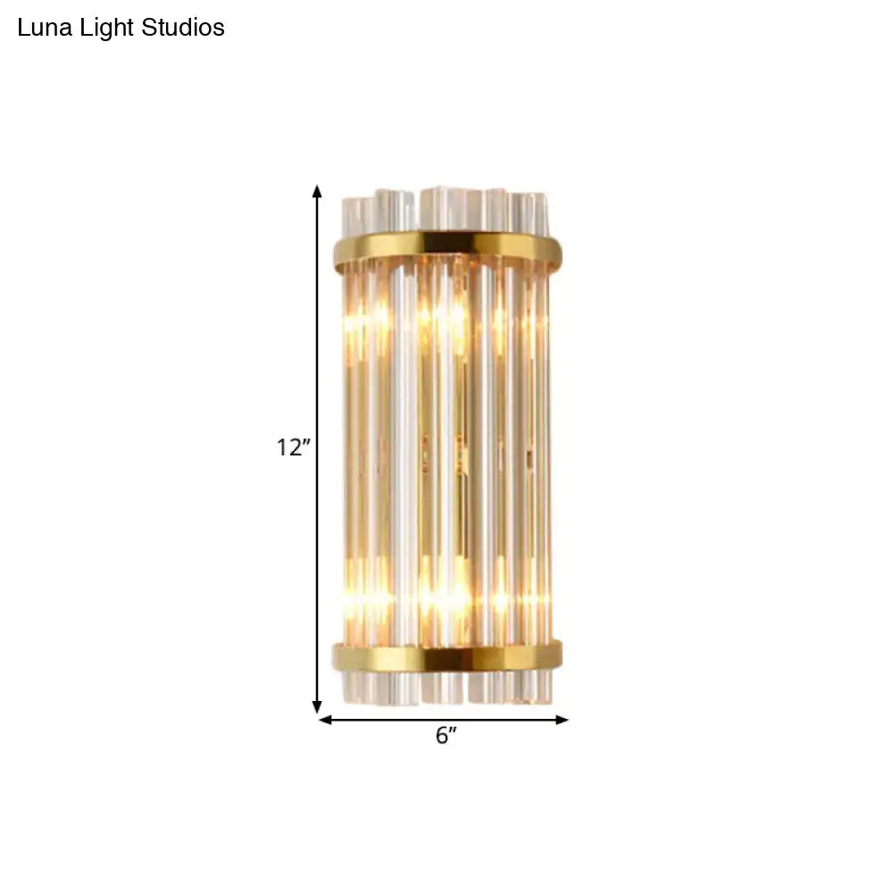 Modern gold wall lamp with crystal rod shade featuring gold-toned cylindrical design and warm glowing light for bedroom use