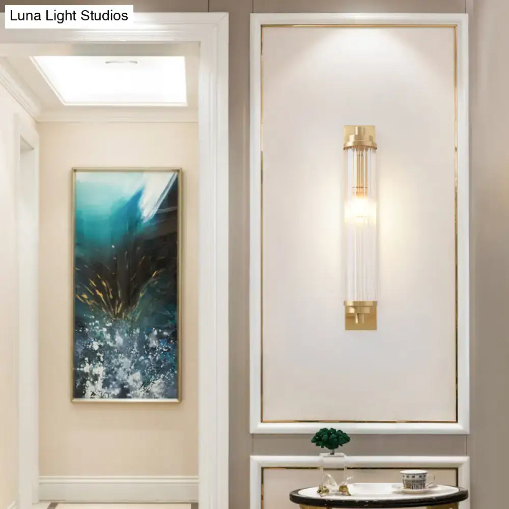 Modern gold wall light fixture with clear glass cylinder and gold metal accents direct wired electric 220v-240v 110v-120v