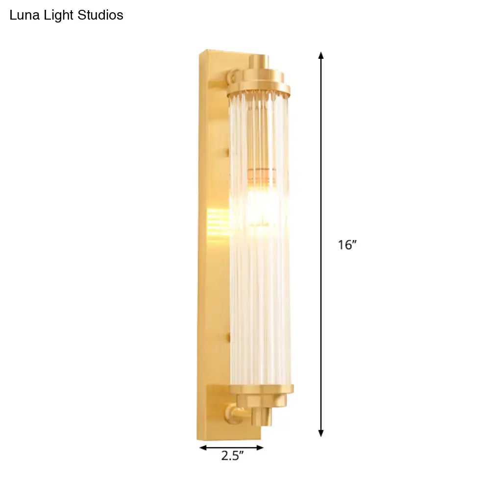 Modern gold wall light fixture with frosted cylindrical glass shade and direct wired electric 220v-240v 110v-120v bulb inside