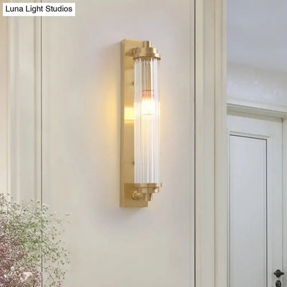 Modern gold wall light fixture with clear glass cylinder and exposed bulb warm light direct wired electric 220v-240v 110v-120v