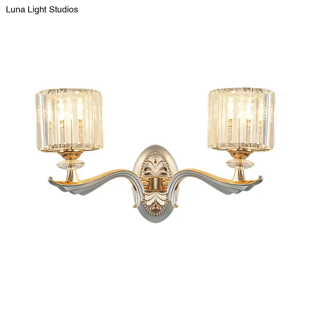 Elegant modern gold wall light with clear crystal shade and gold silver-toned metal arms for living room sconce