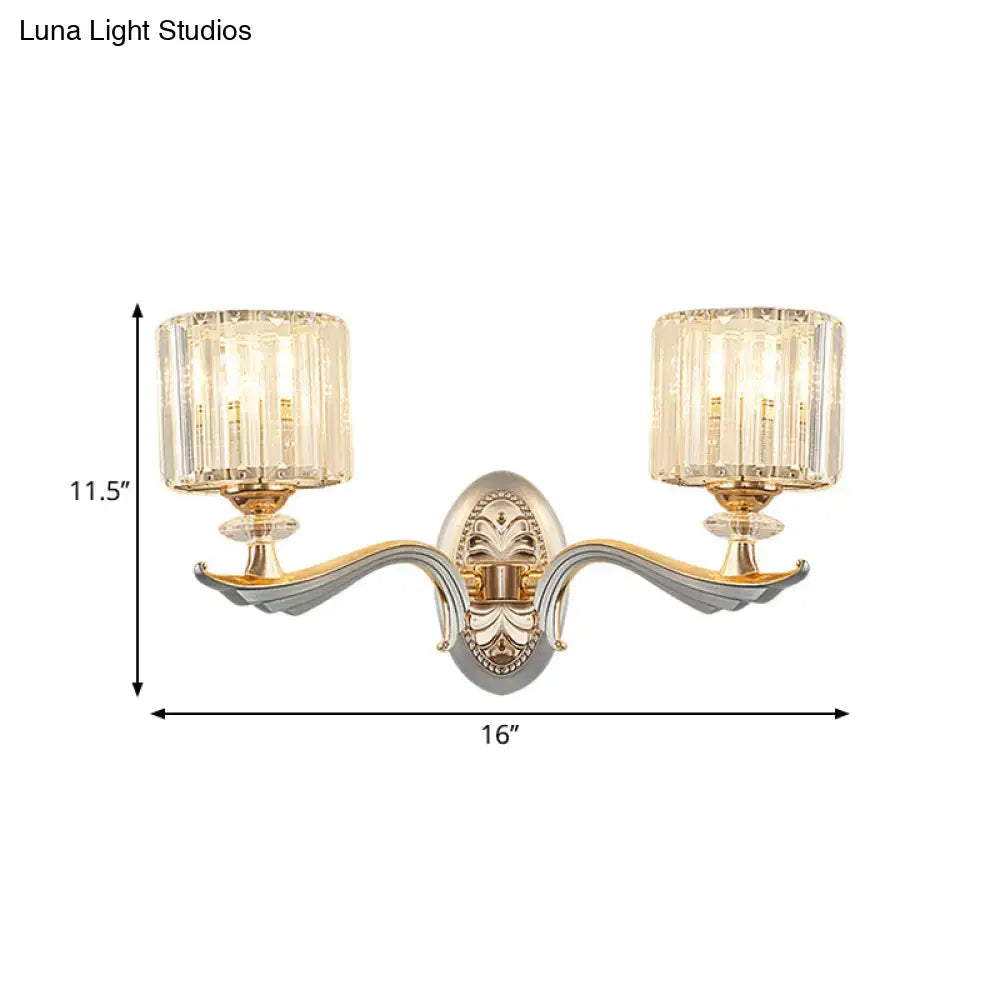 Modern gold wall light with clear crystal shade featuring faceted crystal shades for living room use
