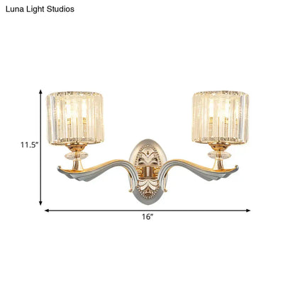 Modern gold wall light with clear crystal shade featuring faceted crystal shades for living room use