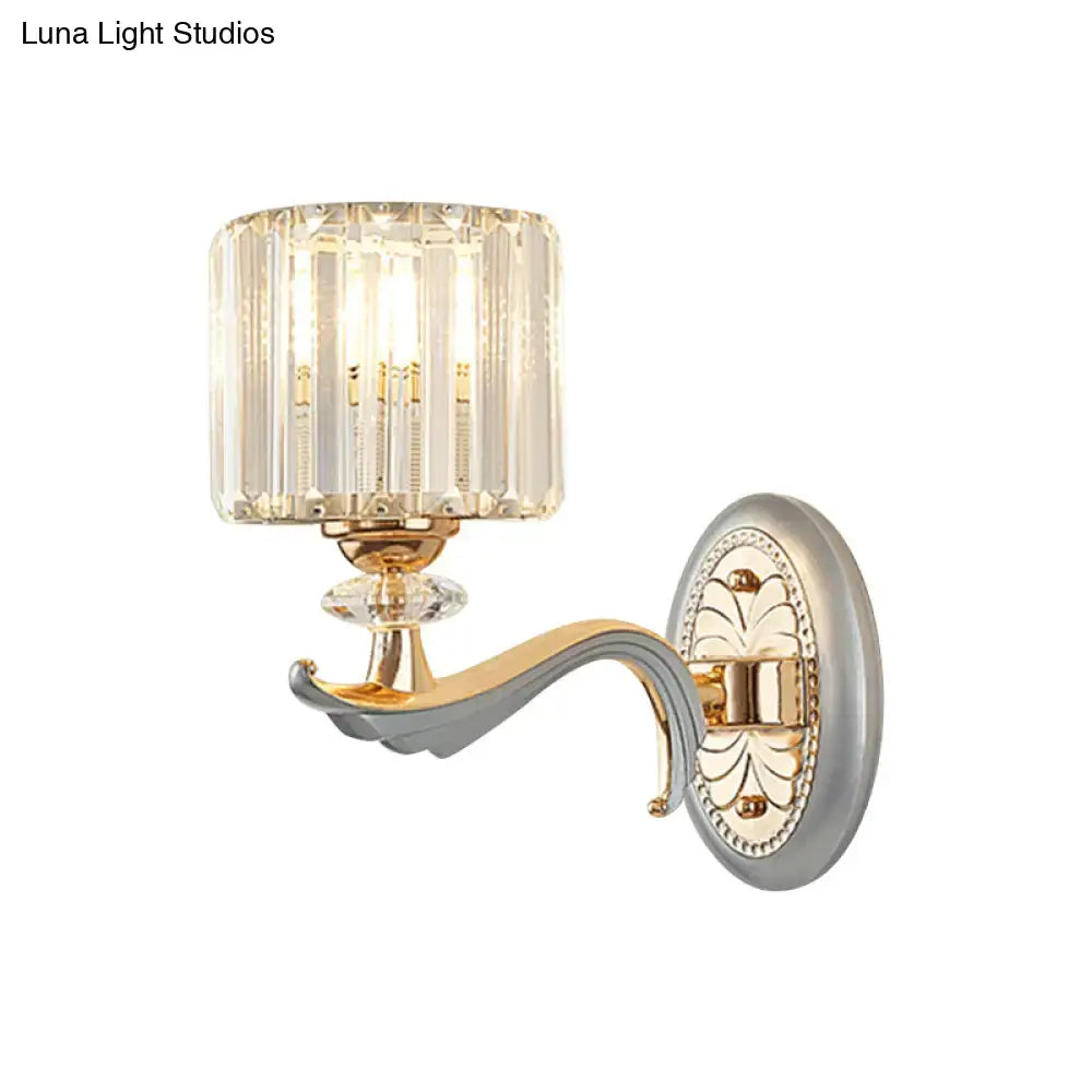 Modern gold wall light with clear crystal shade and faceted crystal design for elegant living room sconce lighting