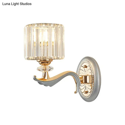 Modern gold wall light with clear crystal shade and faceted crystal design for elegant living room sconce lighting