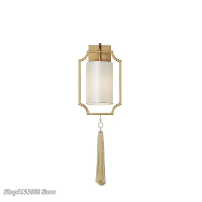 Modern gold wall lights with a frosted glass cylinder shade and beige tassel for stylish living room decorbites copper wall lights