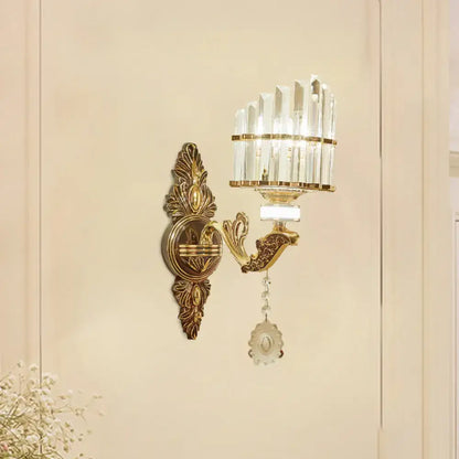 Modern gold wall mount light arc sconce with gold tone ornate design crystal accents and dangling decorative pendant