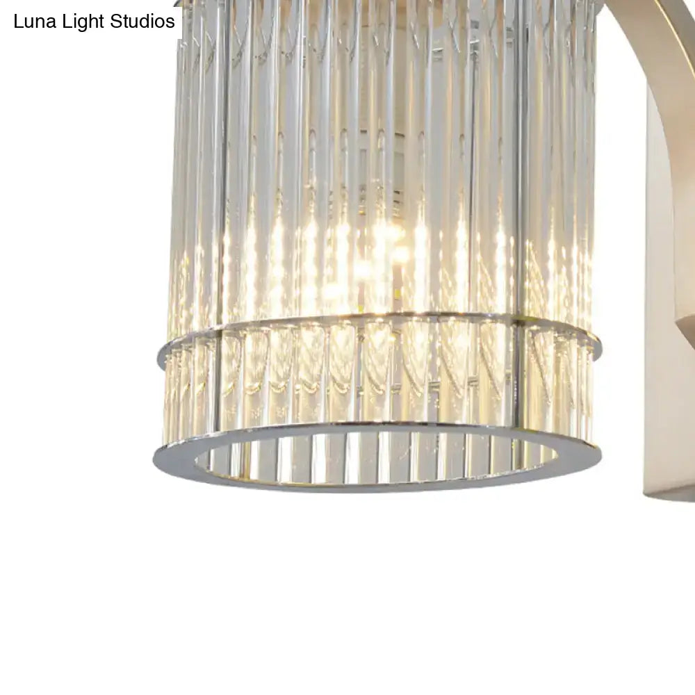 Modern gold wall mounted lamp with clear crystal shade featuring a clear vertically ribbed glass cylinder and chrome frame