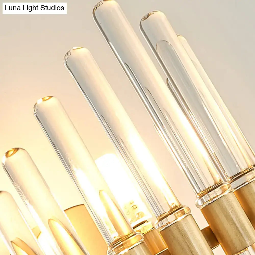 Modern gold wall sconce featuring clear crystal tubes and gold metal bases for elegant living room lighting