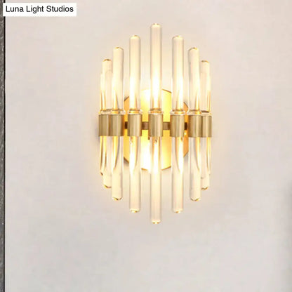 Modern gold wall sconce with clear crystal rods and gold-toned metal accents for stylish living room lighting