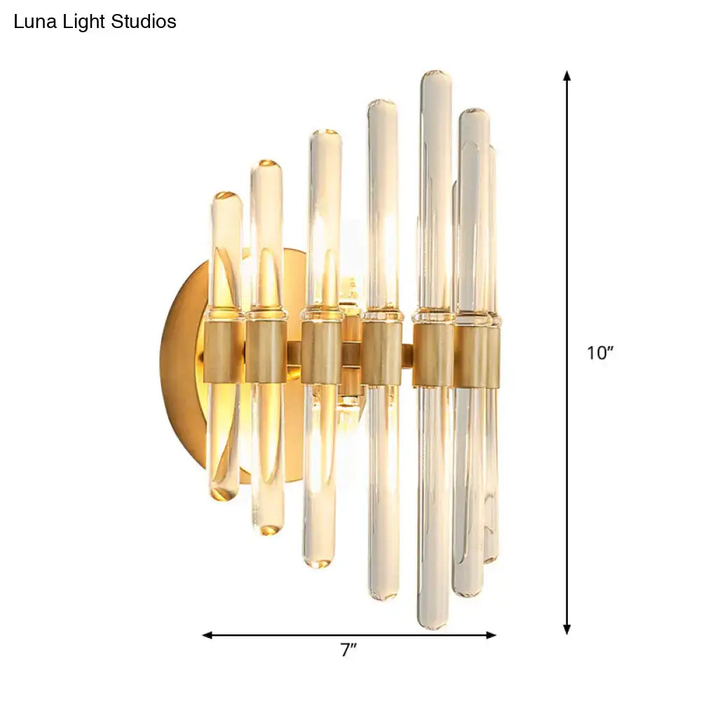 Modern gold wall sconce with clear crystal tubes in amber and clear glass for elegant living room lighting