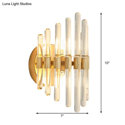 Modern gold wall sconce with clear crystal tubes in amber and clear glass for elegant living room lighting