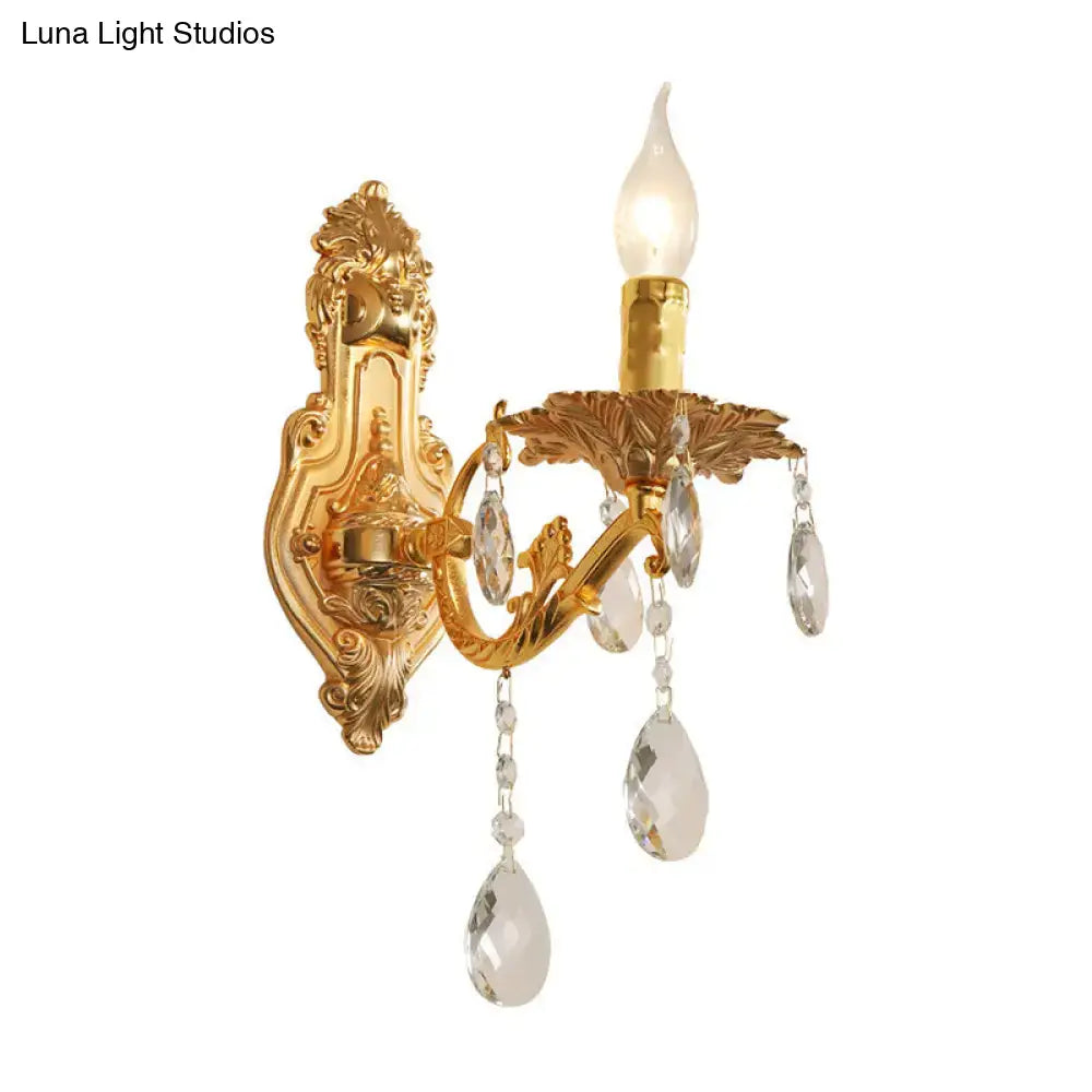 Modern gold wall sconce with ornate design and crystal drops suitable for e12 e14 bulbs in bedroom candelabra style