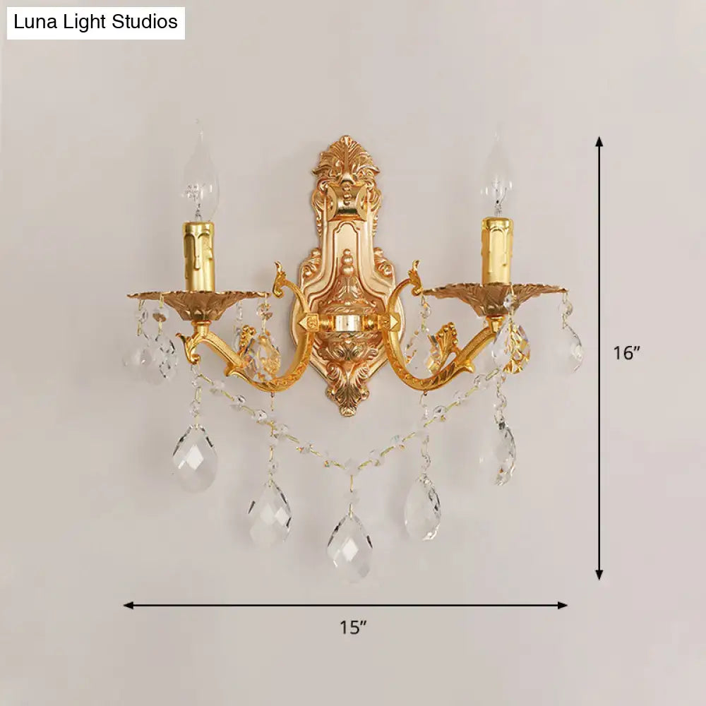 Modern gold wall sconce with crystal drops and candle-style e12 e14 bulbs for elegant bedroom lighting