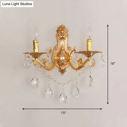Modern gold wall sconce with crystal drops and candle-style e12 e14 bulbs for elegant bedroom lighting
