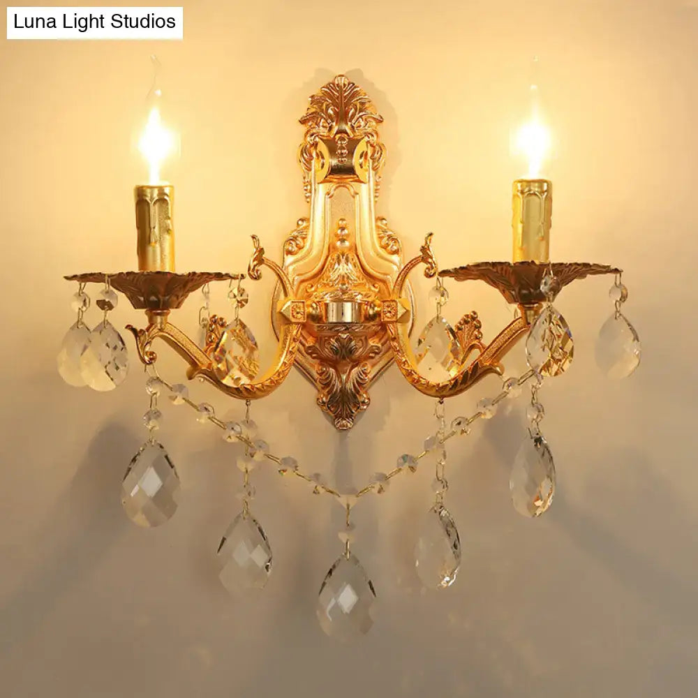 Modern gold wall sconce with crystal drops and candle-style e12 e14 bulbs for elegant bedroom lighting