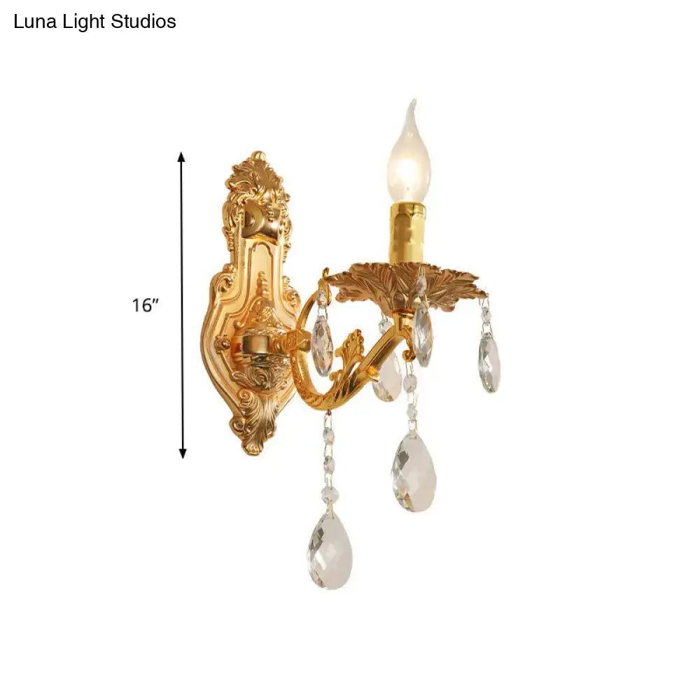Modern gold wall sconce with crystal drops and candle-style e12 e14 bulb for elegant bedroom lighting