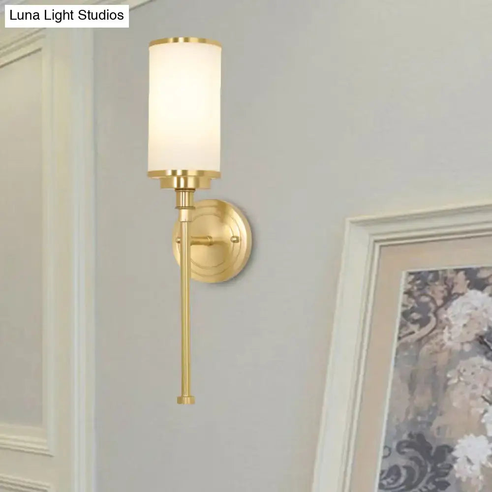 Modern gold wall sconce with milky glass cylindrical shade 8-inch fixture for elegant living room lighting