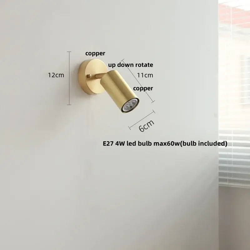 Modern gold walnut wall sconce with copper finish and adjustable spotlight featuring a pull chain switch for bedroom use