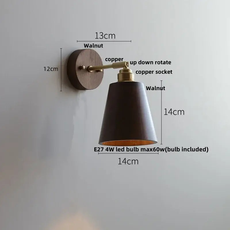 A modern gold walnut wall sconce with dark walnut shade copper accents and adjustable arm featuring pull chain switch