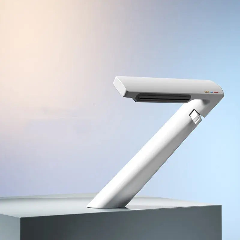 White sleek modern desk lamp with adjustable arm complementing decorbites gold waterfall basin faucet bathroom mixer tap