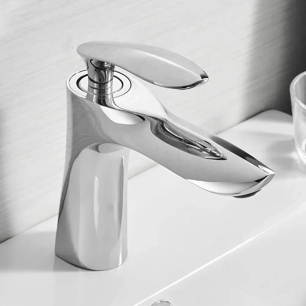 Modern chrome-finished single-handle bathroom faucet with sleek angular design for decorbites gold waterfall bathroom use