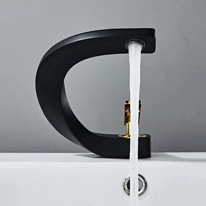 Modern gold waterfall brass basin faucet with black matte finish and gold-toned handle for bathroom decorbites brass basin