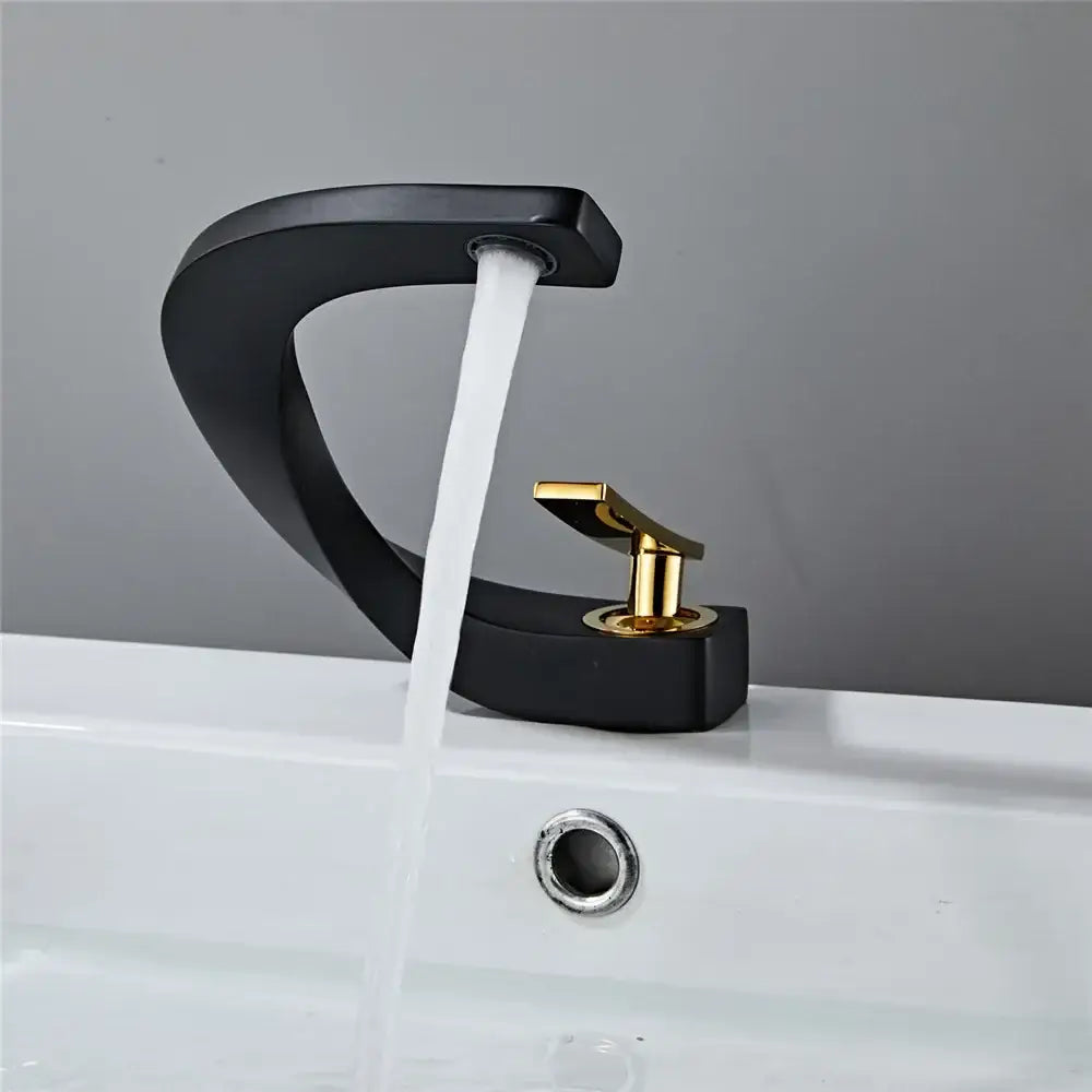 Modern gold waterfall mixer bathroom faucet in black and gold with sleek curved design for stylish bathroom use