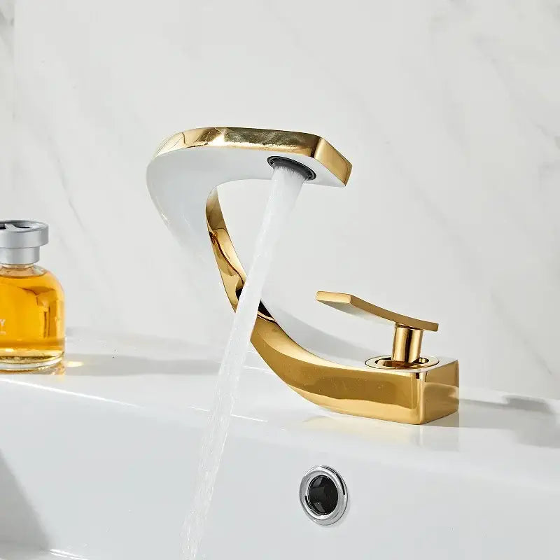 Modern gold waterfall mixer bathroom faucet with sleek curved design and polished metallic finish