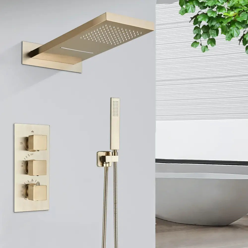 Modern gold-toned rectangular rain shower faucet set with sleek perforated surface for bathroom wall mounting
