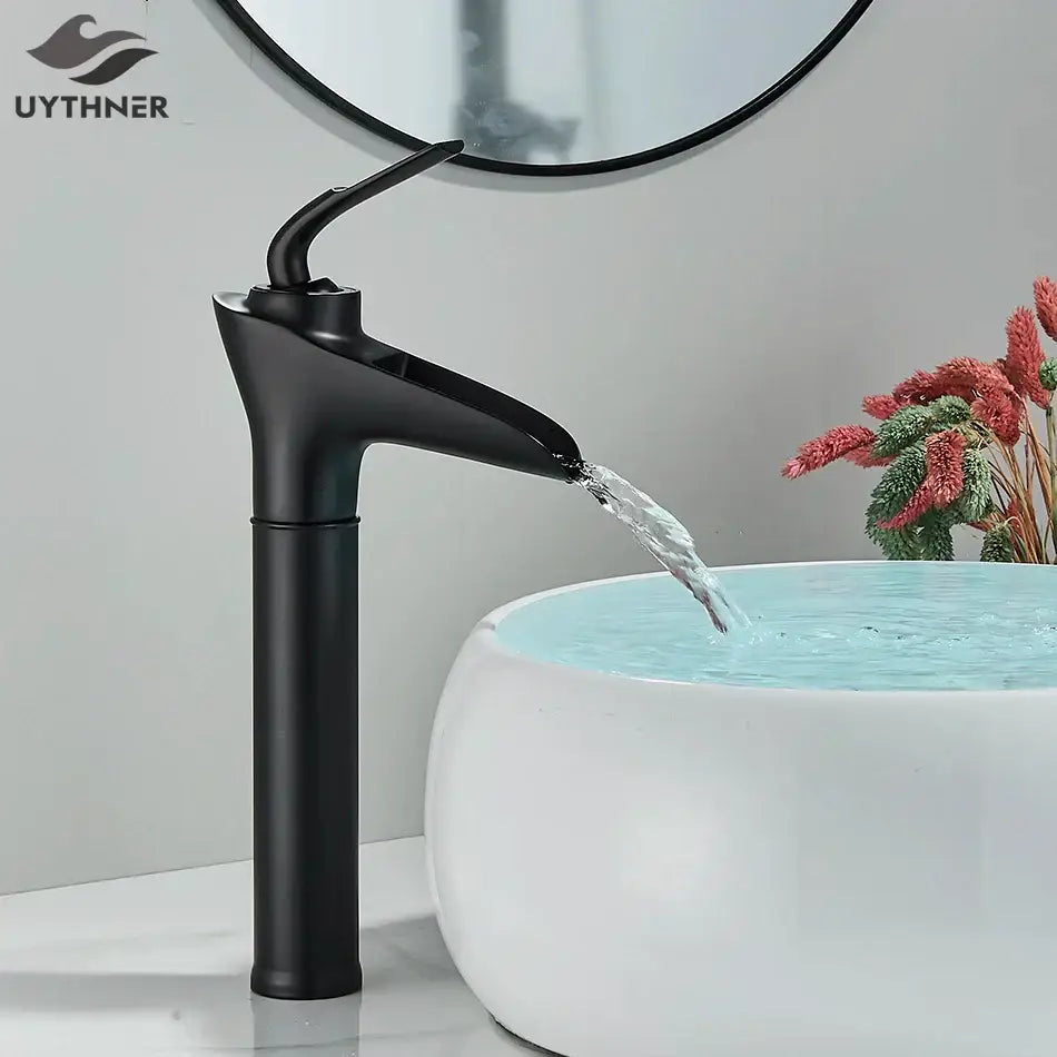 Black matte finish basin faucet with sleek modern design complementing decorbites gold waterfall wine glass basin faucet