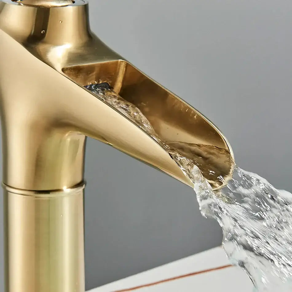 Modern gold waterfall wine glass basin faucet with polished gold-toned finish and sleek decorbites gold waterfall design