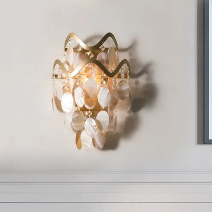 Modern gold wave sconce featuring direct wired electric installation with shell accent mother-of-pearl and crystal droplets