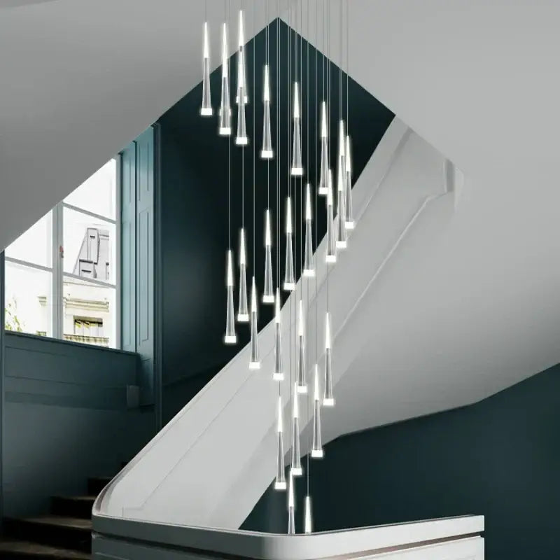 Modern gold and white acrylic led pendant lights with slender transparent glass in a cascading dining room decorbites acrylic led design