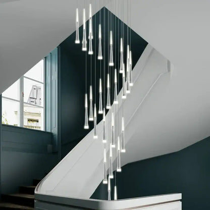 Modern gold and white acrylic led pendant lights with slender transparent glass in a cascading dining room decorbites acrylic led design