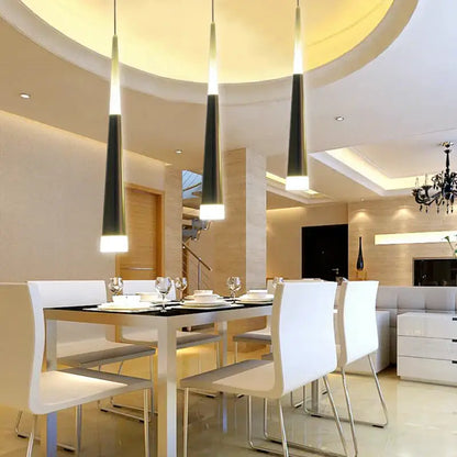 Three sleek tapered black and white decorbites acrylic led pendant lights for modern dining room decor