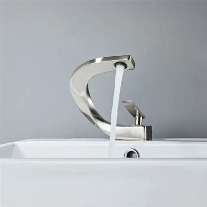 Modern brushed nickel bathroom basin faucet with sleek curved design and single handle for decorbites gold white decor