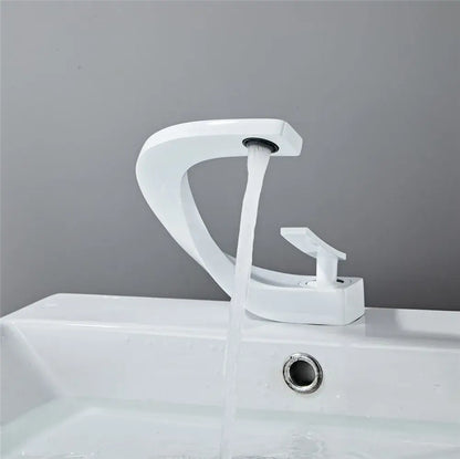 Modern gold white bathroom basin faucet with sleek curved white ceramic spout and single handle decorbites gold white design