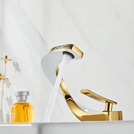 Modern gold and white bathroom basin faucet with sleek curved spout and flowing water for decorbites gold white decor