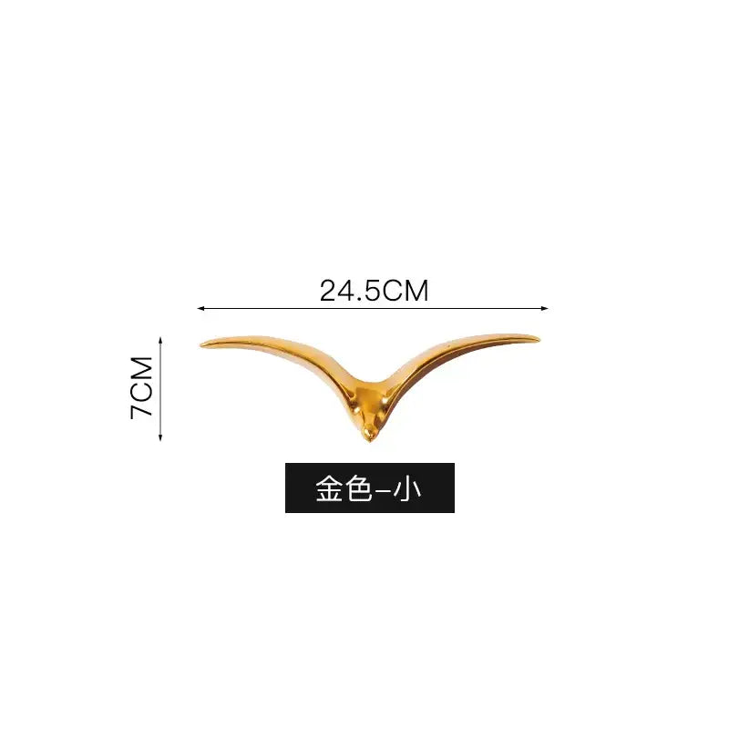 Modern gold ceramic pendant wall decor featuring a sleek bird-shaped ceramic pendant wall decor with glossy finish