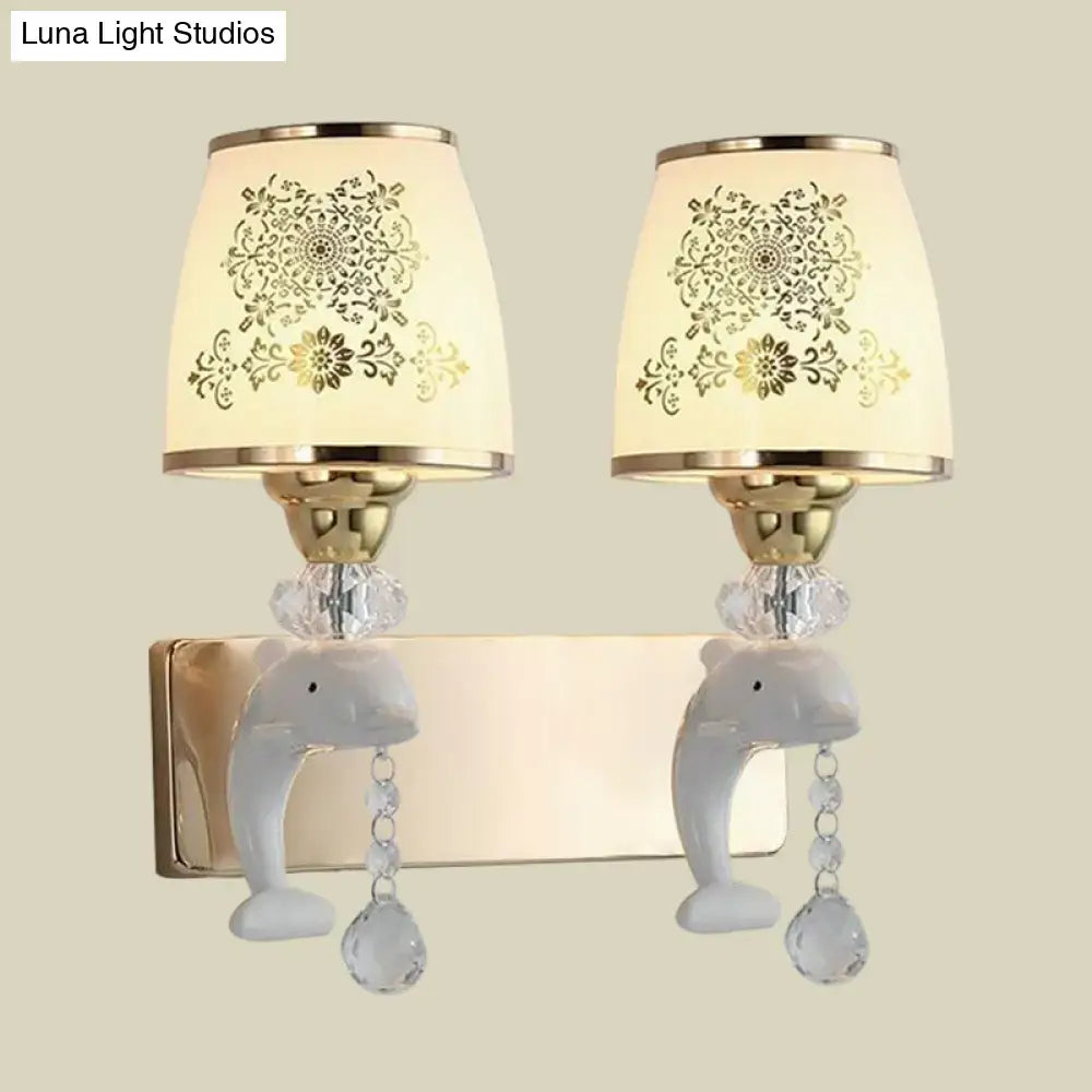 Modern gold and white dolphin wall sconce with opal glass shade cream lampshades and dangling crystal beads