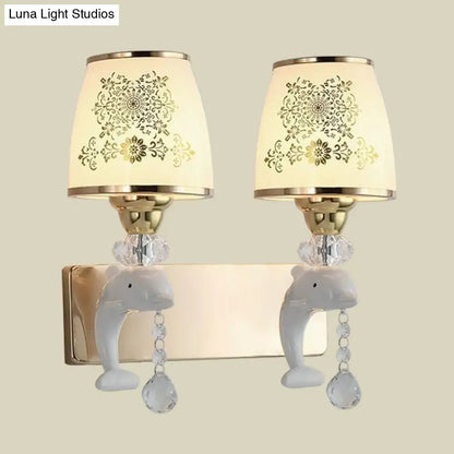 Modern gold and white dolphin wall sconce with opal glass shade cream lampshades and dangling crystal beads