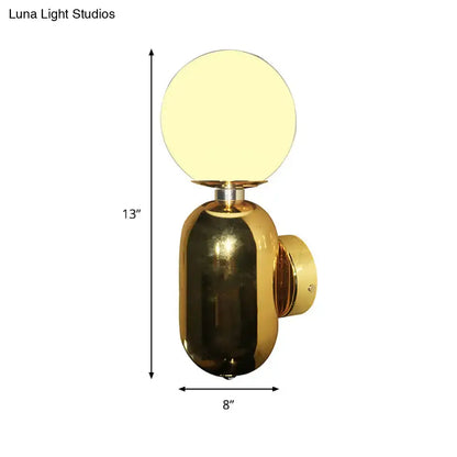 Modern gold wall sconce featuring a white glass globe with frosted finish and e26 e27 compatible base for bedroom lighting